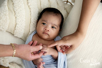 newborn photo with parents hands in Bunbury studio