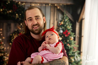 Family enjoying a Christmas mini session with Santa in a styled festive studio in Bunbury Western Australia