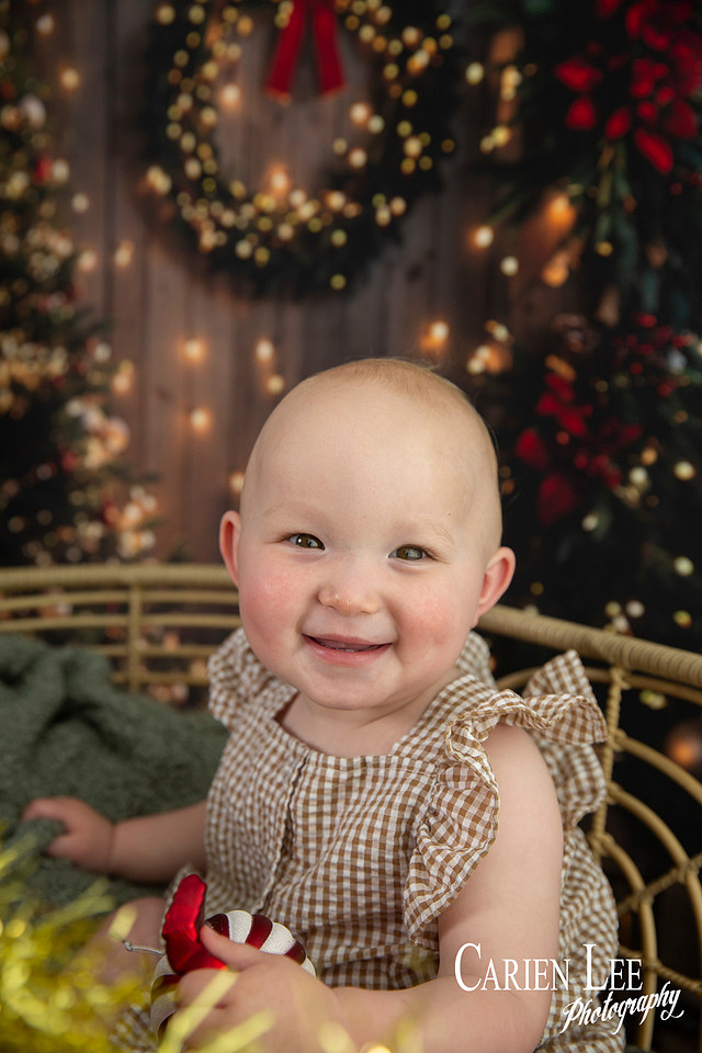 Family enjoying a Christmas mini session with Santa in a styled festive studio in Bunbury Western Australia