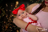 Family enjoying a Christmas mini session with Santa in a styled festive studio in Bunbury Western Australia