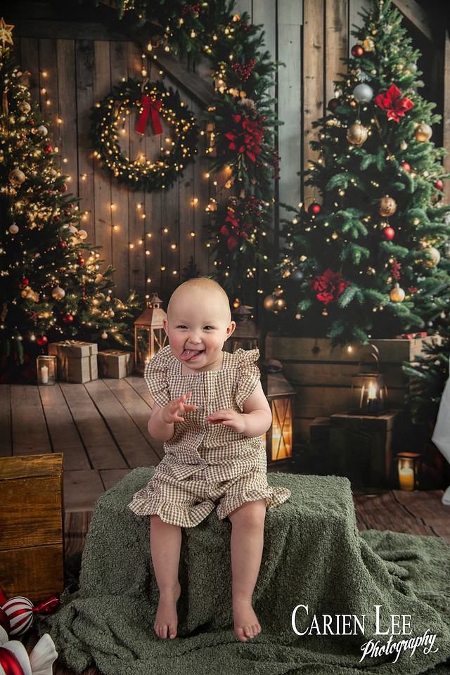 Family enjoying a Christmas mini session with Santa in a styled festive studio in Bunbury Western Australia