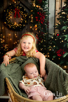 Family enjoying a Christmas mini session with Santa in a styled festive studio in Bunbury Western Australia