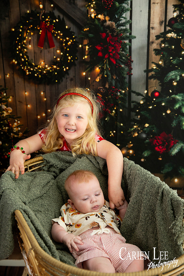 Family enjoying a Christmas mini session with Santa in a styled festive studio in Bunbury Western Australia