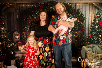 Family enjoying a Christmas mini session with Santa in a styled festive studio in Bunbury Western Australia