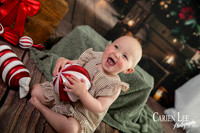 Family enjoying a Christmas mini session with Santa in a styled festive studio in Bunbury Western Australia