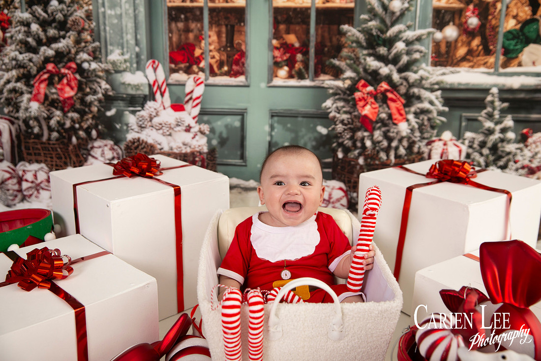 Child sitting on Santa’s lap for Christmas photo Bunbury