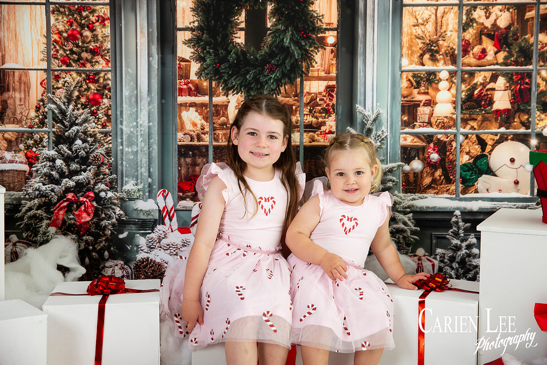 Family enjoying a Christmas mini session with Santa in a styled festive studio in Bunbury Western Australia