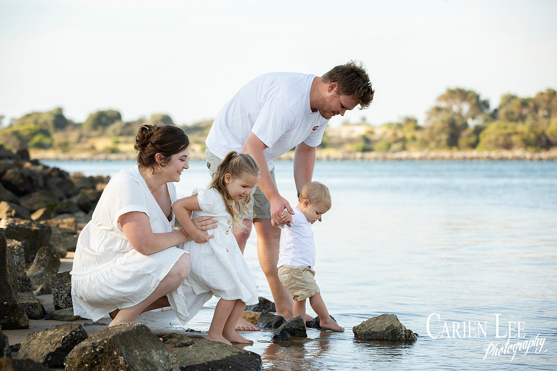 Family interacting naturally during a lifestyle photography session in Bunbury