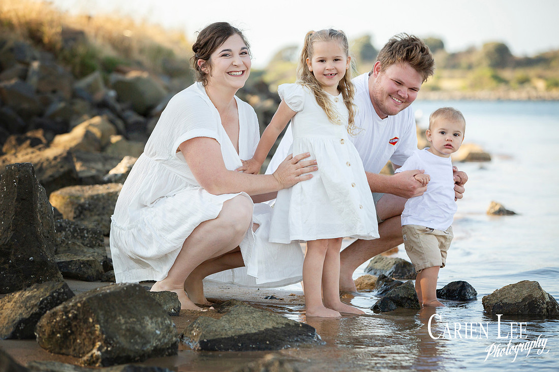 Family interacting naturally during a lifestyle photography session in Bunbury