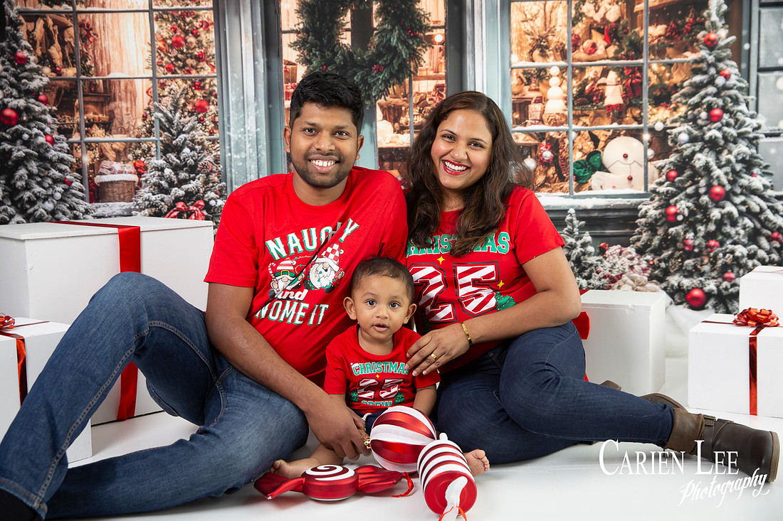 Child smiling with Santa during Bunbury Christmas mini session