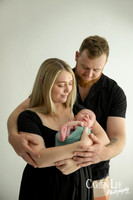 Newborn baby wrapped in soft blankets during Bunbury newborn photography session