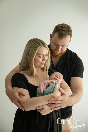 Newborn baby wrapped in soft blankets during Bunbury newborn photography session