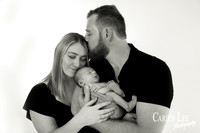 Newborn baby wrapped in soft blankets during Bunbury newborn photography session