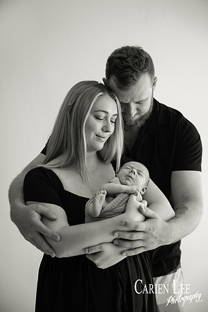 Newborn baby wrapped in soft blankets during Bunbury newborn photography session