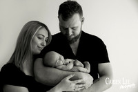 Newborn baby wrapped in soft blankets during Bunbury newborn photography session