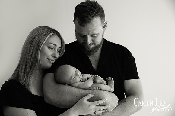 Newborn baby wrapped in soft blankets during Bunbury newborn photography session