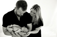 Newborn baby wrapped in soft blankets during Bunbury newborn photography session