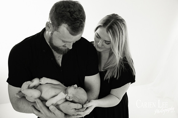 Newborn baby wrapped in soft blankets during Bunbury newborn photography session