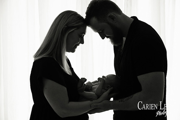 Newborn baby wrapped in soft blankets during Bunbury newborn photography session