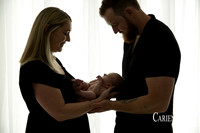 Newborn baby wrapped in soft blankets during Bunbury newborn photography session