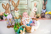 Baby in a basket in Easter photography studio