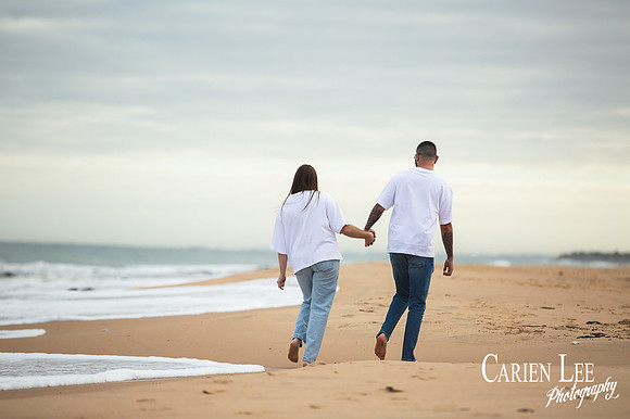 Photo of an engaged couple on Bunbury Back Beach