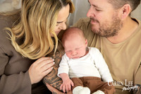 new mother gently kissing her newborn baby during mothers day session in Bunbury