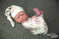 Newborn Girl posing herself during a newborn session