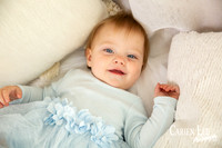 One-year-old girl smiling during motherhood photography session