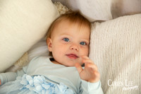 One-year-old girl smiling during motherhood photography session
