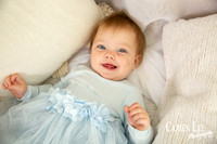 One-year-old girl smiling during motherhood photography session