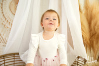 One-year-old girl smiling during motherhood photography session
