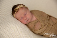 Baby girl newborn wrapped up in studio in Bunbury