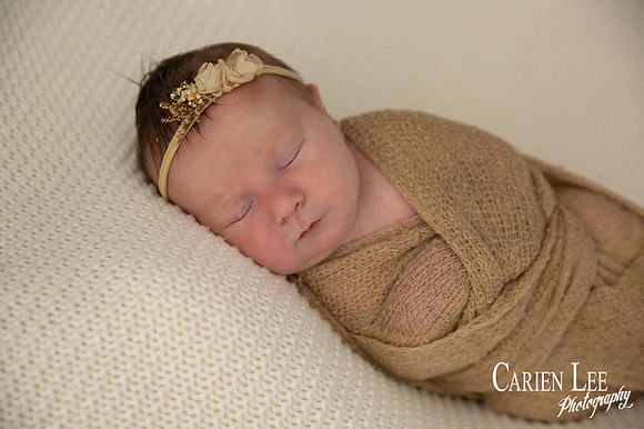Baby girl newborn wrapped up in studio in Bunbury