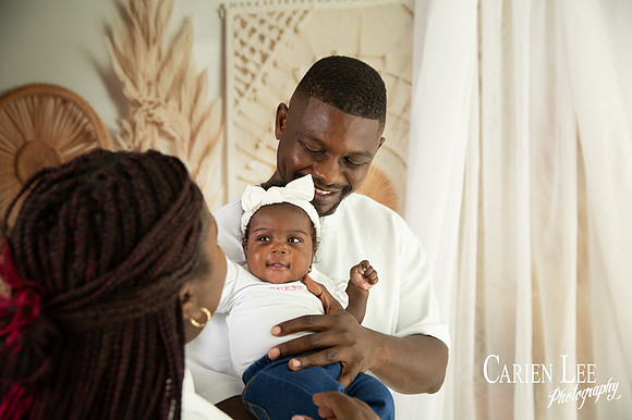 Young mother and father with their first baby during a family session in Bunbury