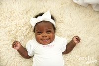 cute baby girl smiling for the camera in Bunbury studio