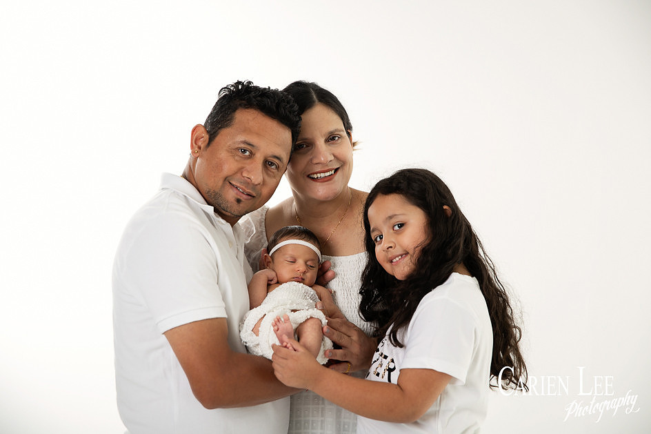 Family photo with parents and sibling during a newborn family session in Bunbury