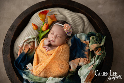 Galvez family newborn photography session in Bunbury featuring parents, newborn baby girl and family puppy captured by a professional Bunbury newborn photographe