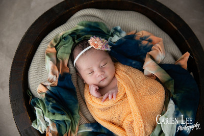 Galvez family newborn photography session in Bunbury featuring parents, newborn baby girl and family puppy captured by a professional Bunbury newborn photographe