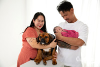 Galvez family newborn photography session in Bunbury featuring parents, newborn baby girl and family puppy captured by a professional Bunbury newborn photographer.