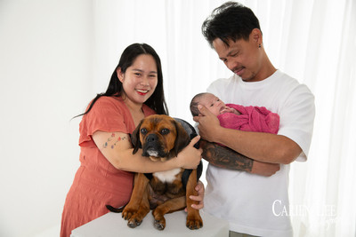Galvez family newborn photography session in Bunbury featuring parents, newborn baby girl and family puppy captured by a professional Bunbury newborn photographer.