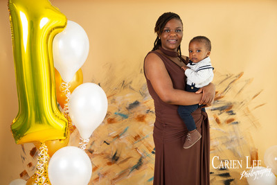 1 year old baby boy during a photo shoot with his mother