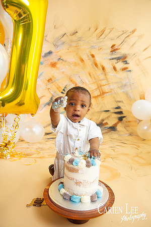 1 year old boy smashing his cake during a dalyellup cake smash session