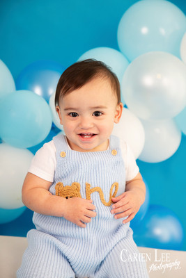 Elijah smiling during his first birthday milestone photography session in Bunbury
