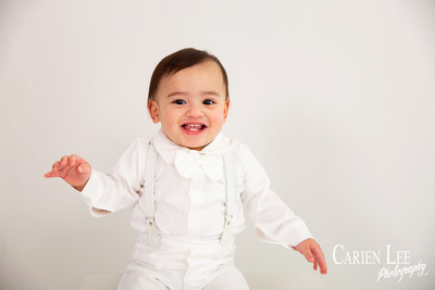 Elijah and his mum sharing a loving moment during a first birthday photography session