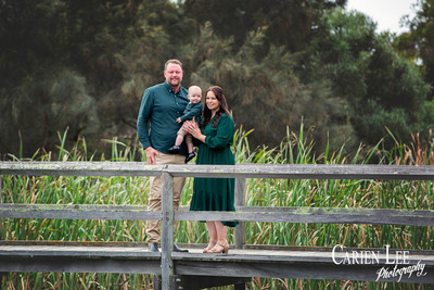 Parents cuddling children during family photo session