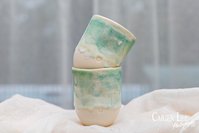 Close-up of handcrafted pottery showcasing detailed textures and glazing.