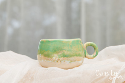 Close-up of handcrafted pottery showcasing detailed textures and glazing.
