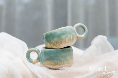 Commercial product photography highlighting handcrafted pottery in natural tones.