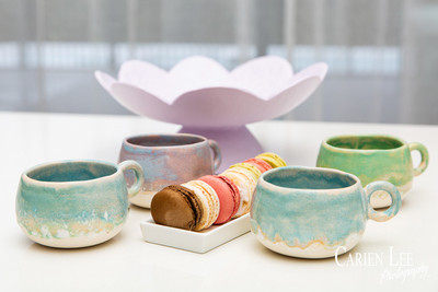 Commercial product photography highlighting handcrafted pottery in natural tones.